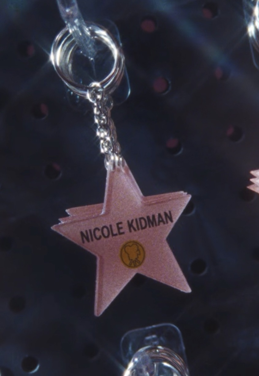 Pink star keychain with a celebrity name